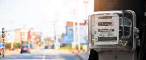 Canvas Print Watthour meter of electricity hung on the cement pole beside the road to monitor and measure power usage each houses in Asian countres