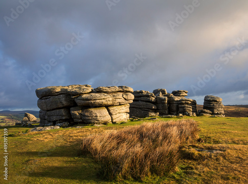 Vibrant clouds over Combestone Tor on Dartmoor Devon in the west country of England UK photo
