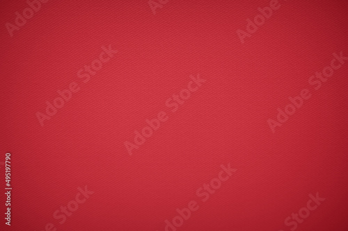 Closeup of red fabric textile material as texture or background. Red Background With Textures and Vignette