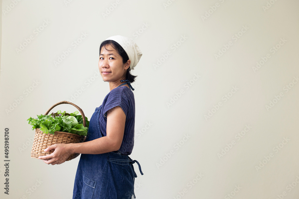 person holding a basket of vegetables person holding a basket of vegetables