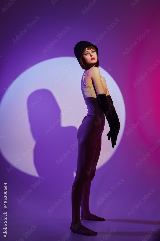 glamorous woman posing studio light neon color background unaltered