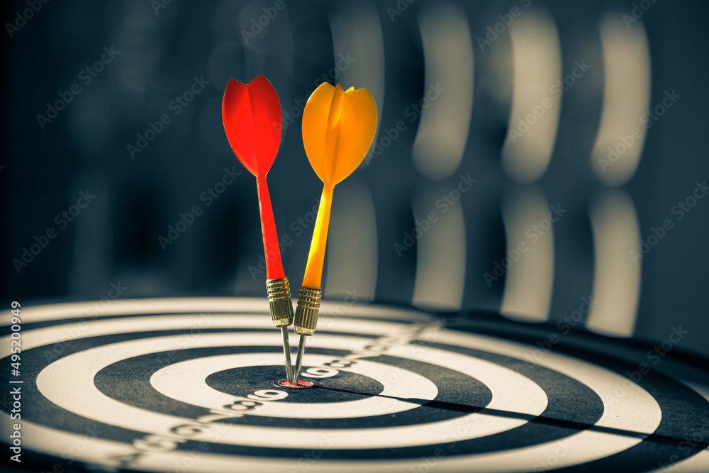 Bullseye target goal or dartboard has dart arrow throw hitting center shooting for financial business targeting planning to winner concept. Bullseye target goal or dartboard has dart arrow throw hitting center shooting for financial business targeting planning to winner concept.
