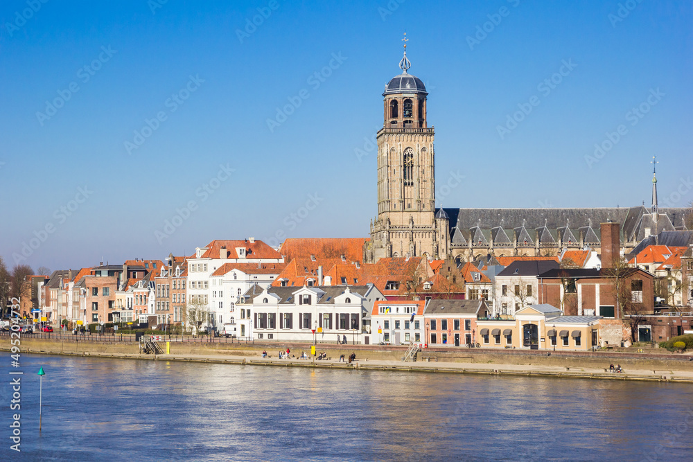 IJssel river and church tower in the skyline of Deventer, Netherlands