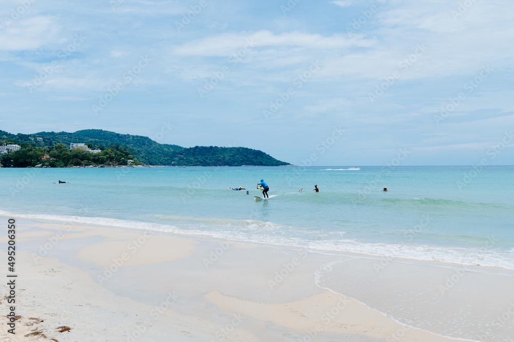 Tourist are surfing  at Kata beach, Phuket, Thailand : The famous beach in Phuket, Thailand