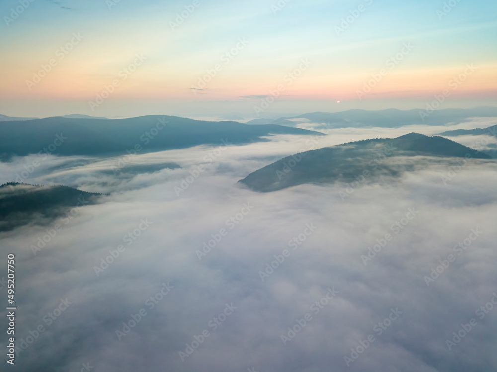 Morning fog in the Ukrainian Carpathians. Aerial drone view.