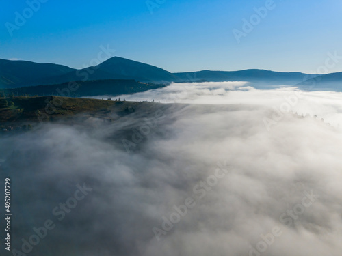 Morning fog in the Ukrainian Carpathians. Aerial drone view.