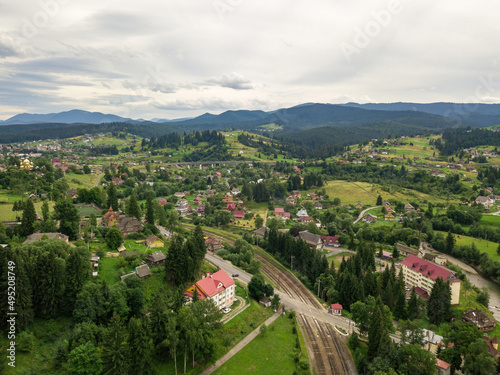 Settlement in the mountains of the Ukrainian Carpathians. Aerial drone view. © Sergey