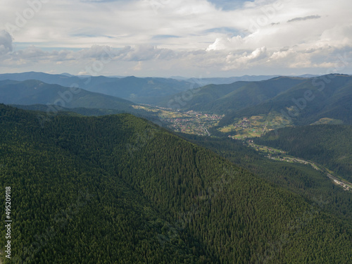 Green mountains of Ukrainian Carpathians in summer. Aerial drone view.