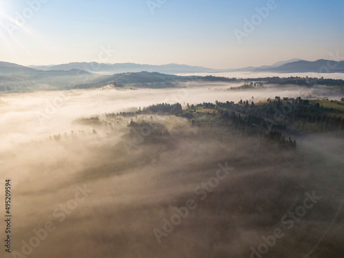 Morning fog in the Ukrainian Carpathians. Aerial drone view.