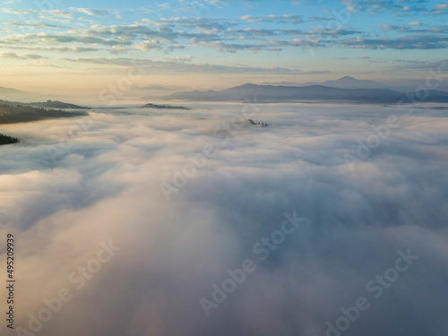 Morning fog in the Ukrainian Carpathians. Aerial drone view.