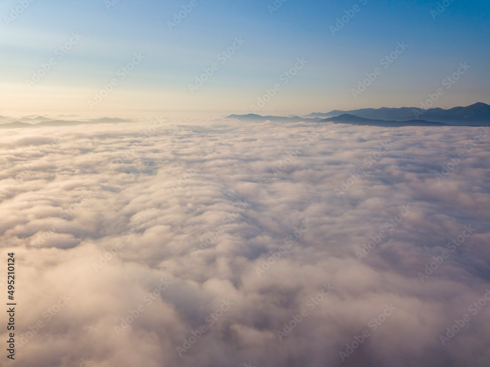 High flight above the clouds. Aerial drone view. High flight above the clouds. Aerial drone view.