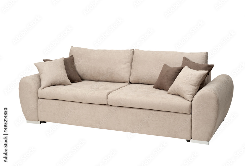 Naklejka premium Large beige sofa with pillows, isolated on white background