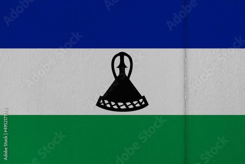 Patriotic wooden background in colors of national flag. Lesotho