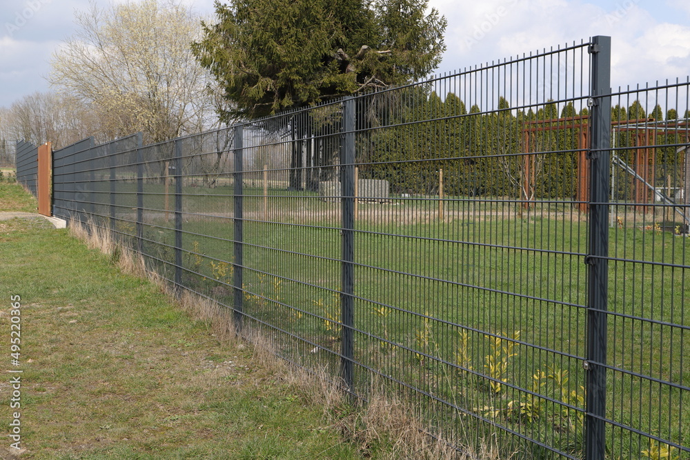a garden fence made of metal a garden fence made of metal
