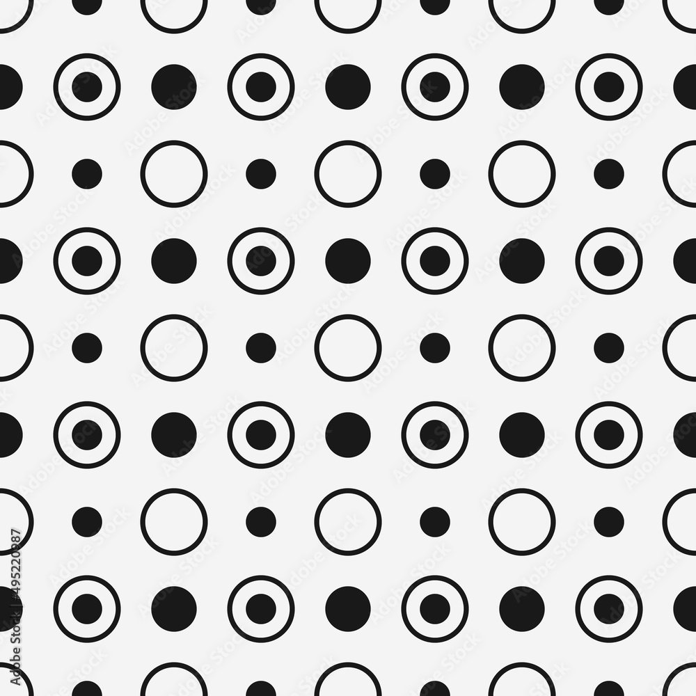 Polka dots in black on a seamless canvas. Vector.