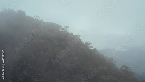 Drone flies through clouds, high mountain landscape in Mexico 