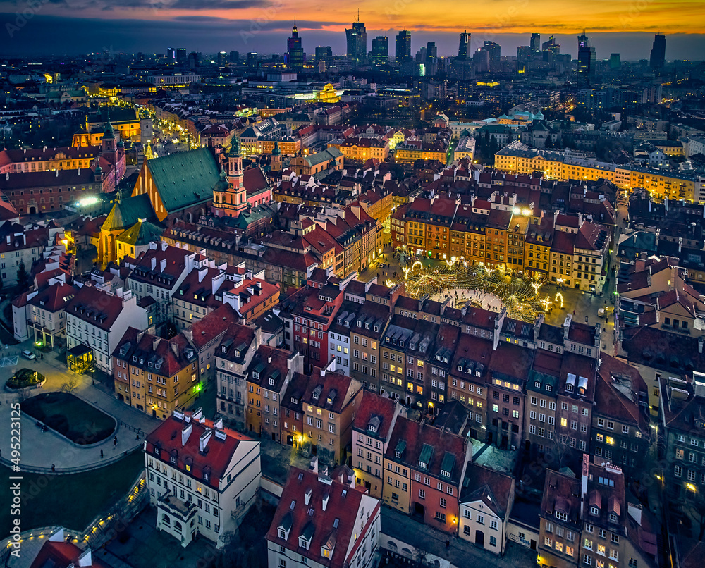 Naklejka premium Beautiful panoramic aerial drone skyline sunset view of the Warsaw City Centre with skyscrapers of the Warsaw City and Warsaw's old town with a market square and a mermaid statue, Poland, EU