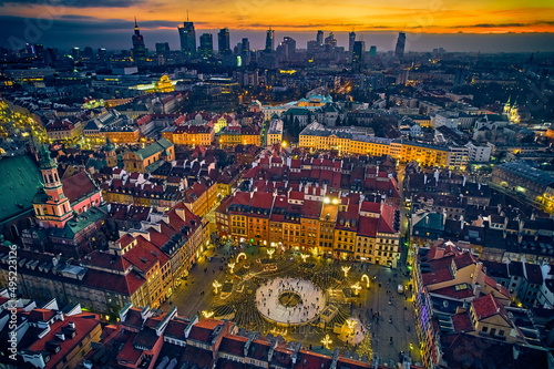 Beautiful panoramic aerial drone skyline sunset view of the Warsaw City Centre with skyscrapers of the Warsaw City and Warsaw s old town with a market square and a mermaid statue  Poland  EU