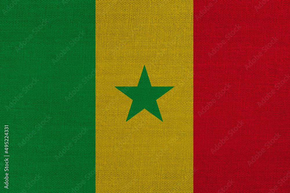 Patriotic textile background in colors of national flag. Senegal