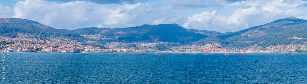 A panorama view from the cruise terminal across the Vigo estuary Spain on a spring day