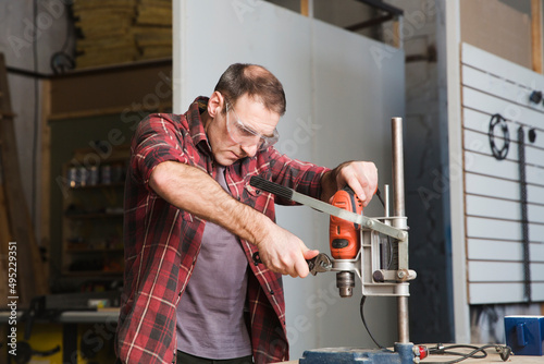 small business. creative workshops. man carpenters working at workbench in industry 