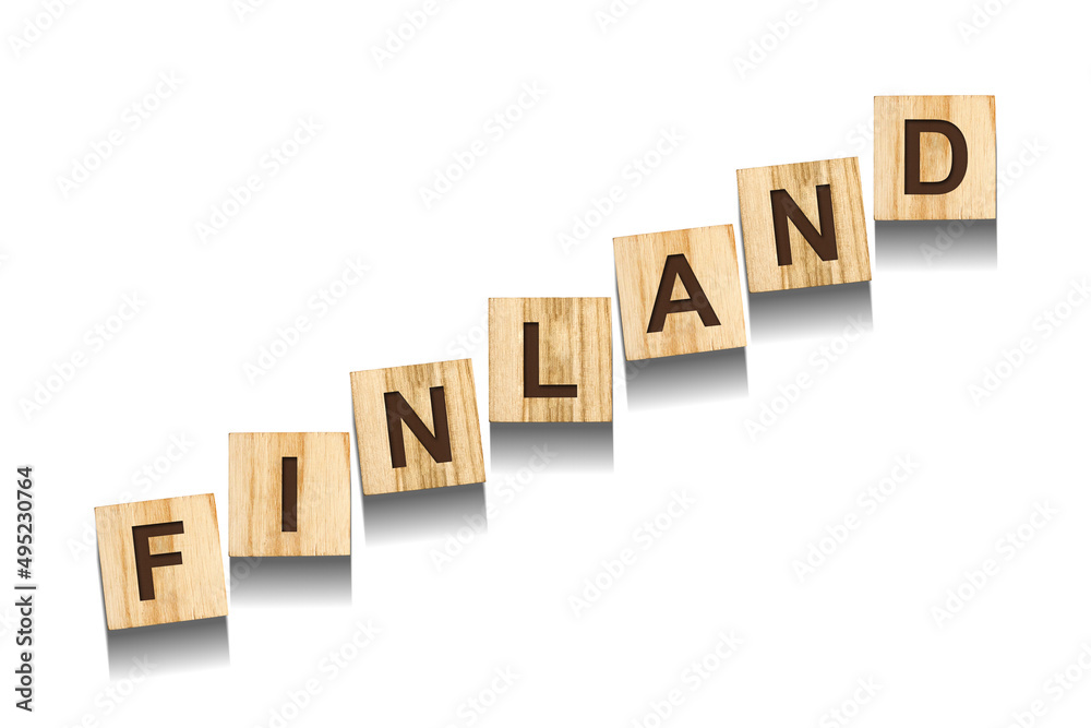 Finland, word on wooden blocks. Isolated on a white background. Finland, word on wooden blocks. Isolated on a white background.