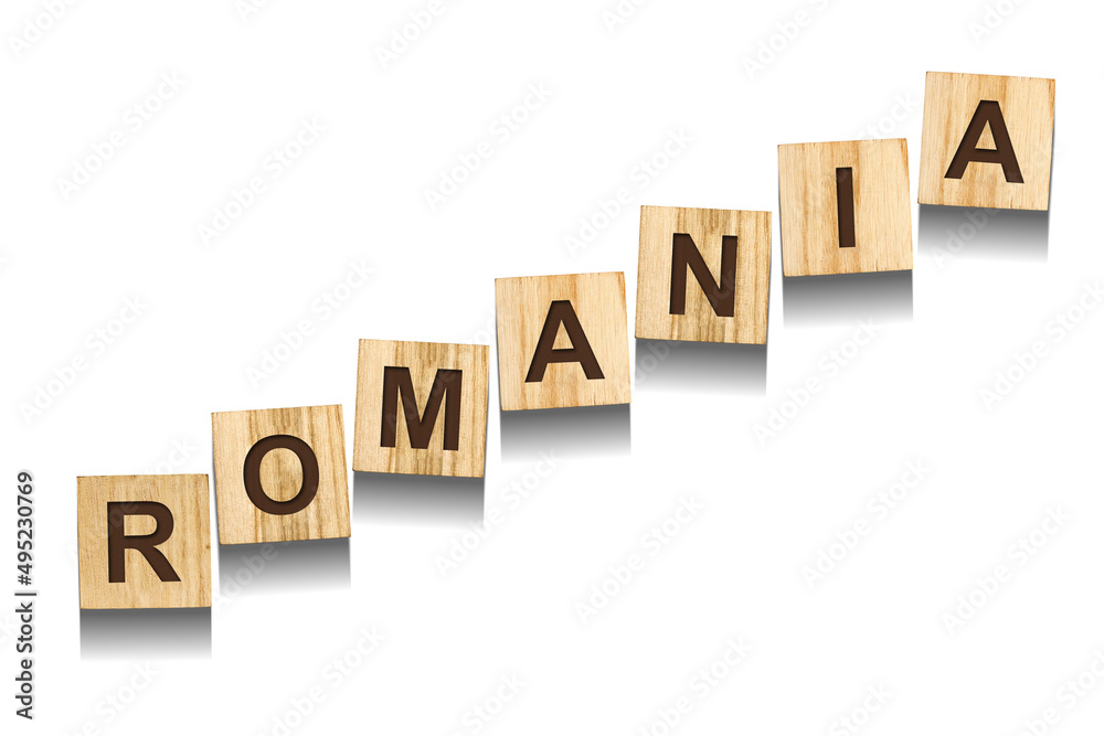 Romania, word on wooden blocks. Isolated on a white background. Romania, word on wooden blocks. Isolated on a white background.