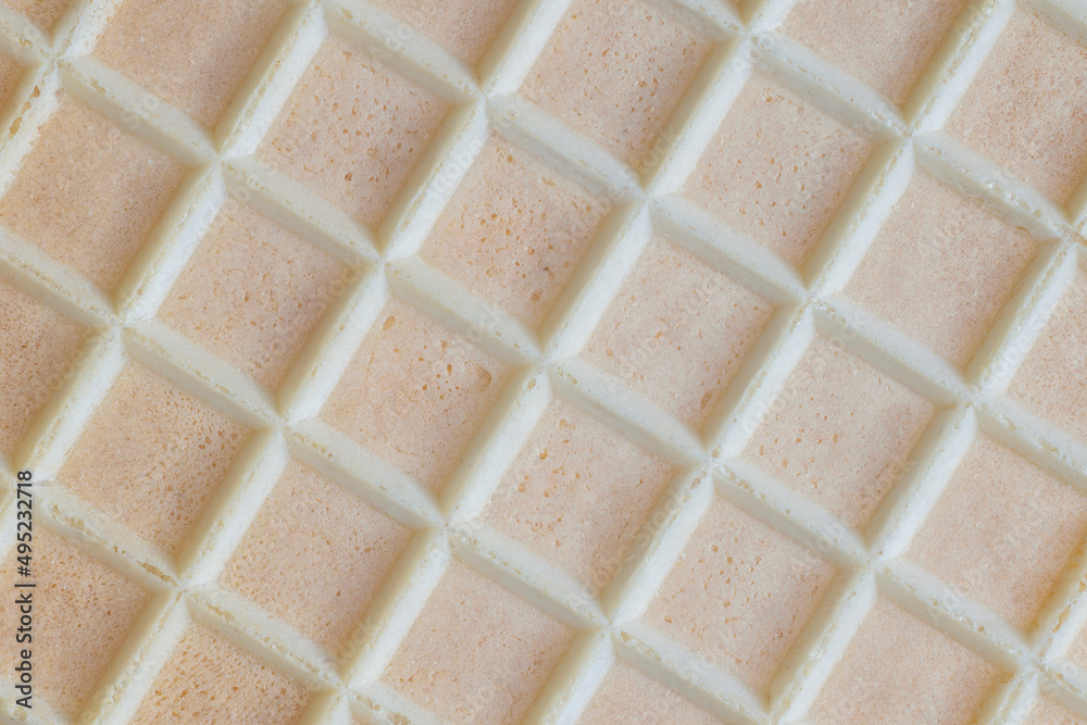 Fototapeta premium A biscuit wafer sheet with a square rough texture