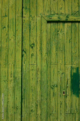 Background texture of an old worn wooden door in the village of Luna, in the region of Cinco Villas, province of Zaragoza, Aragon, Spain