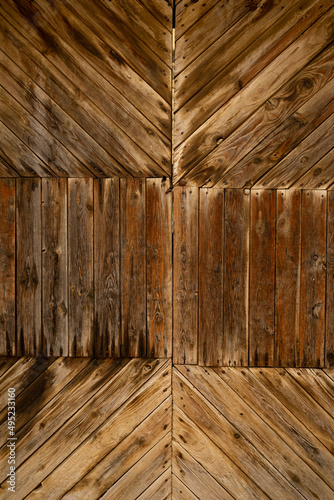 Background texture of an old worn wooden door in the village of Luna, in the region of Cinco Villas, province of Zaragoza, Aragon, Spain