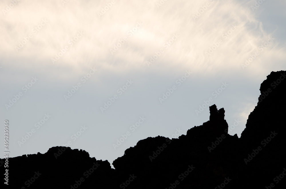 Naklejka premium Rocky profile and clouds. Teide National Park. Tenerife. Canary Islands. Spain.