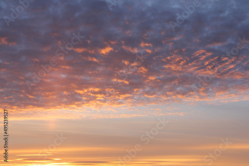 Sunset. Sky with clouds. With shades of pink and yellow. © DIMA
