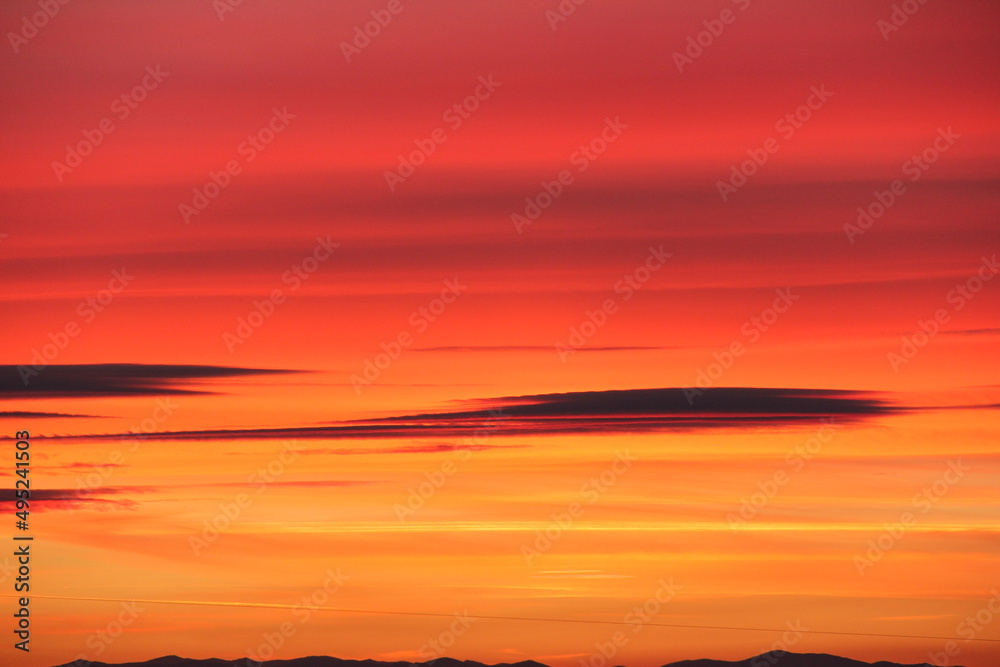 Fototapeta premium Sunset. Sky with clouds. With shades of pink and yellow.