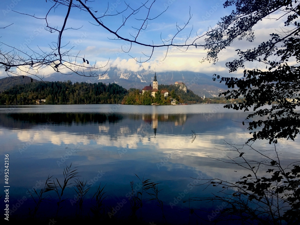 Lake Bled Slovenia with amazing Mountain View. Most famous Slovenian lake with Pilgrimage church reflection on the water.