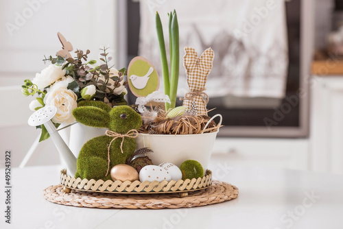 Sticker An iron pot with Easter eggs, flowers and rabbits on the table