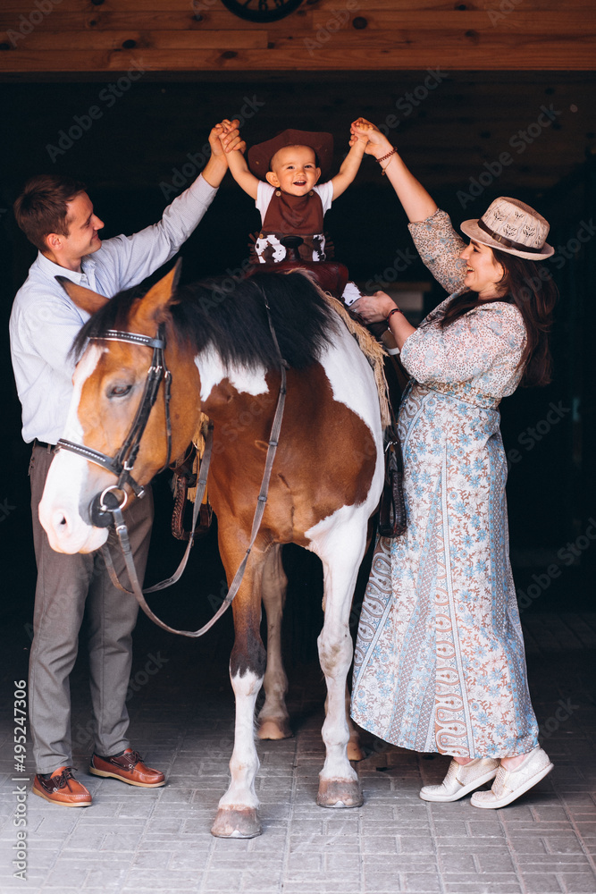 Family with little son at ranch