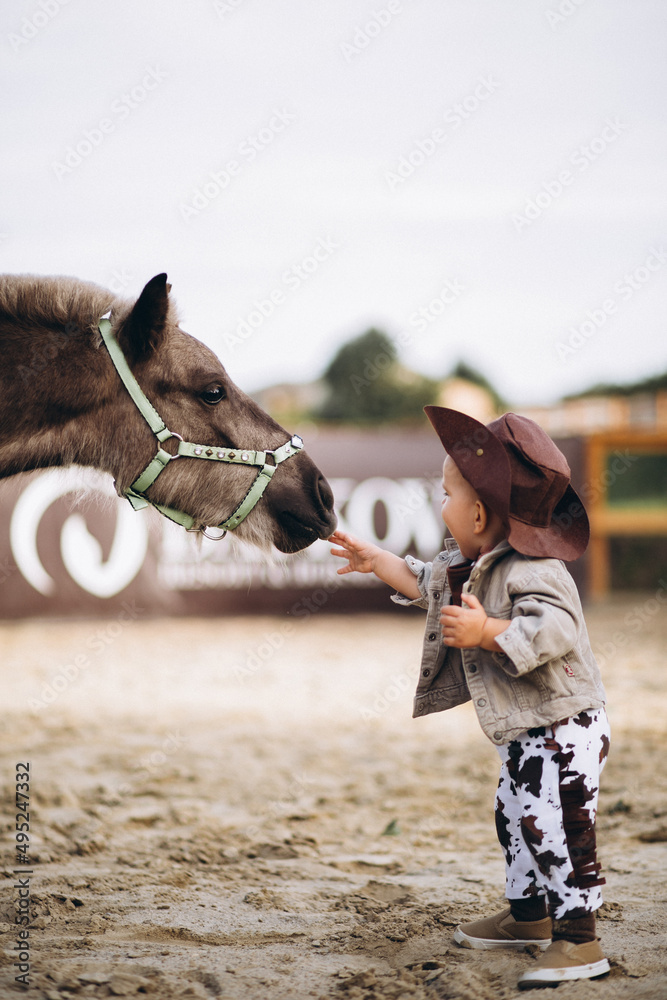 Little cowboy at ranch
