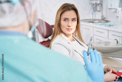 Woman having appointment with doctor in dental clinic