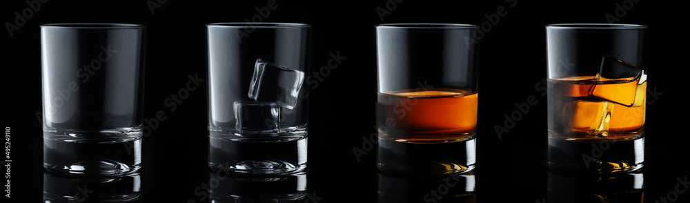 Set of alcoholic beverages. Scotch whiskey in elegant glass with ice cubes on black background. Set of alcoholic beverages. Scotch whiskey in elegant glass with ice cubes on black background.