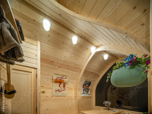 Wooden interior of modern bathhouse. Table and benches. photo