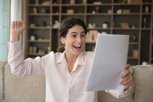 Принти на полотні Overjoyed cheerful student girl getting good news mail, reading acceptance lette