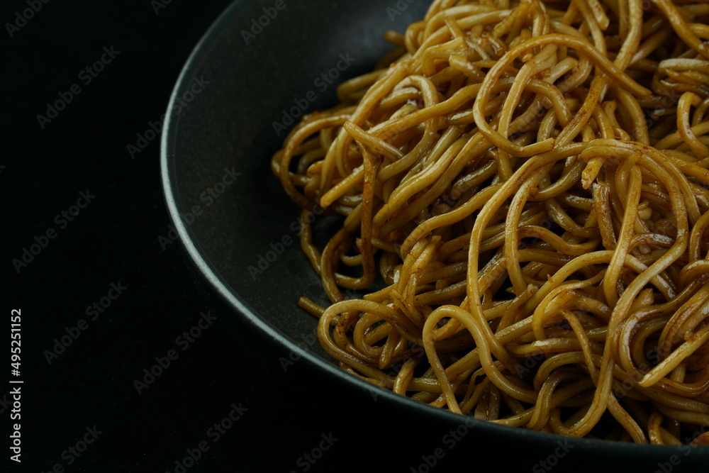 Spaghetti, pasta with tomato sauce and cherry tomatoes with basil on a dark background. Selective focus, copy space. shrimp spaghetti. Spaghetti, pasta with tomato sauce and cherry tomatoes with basil on a dark background. Selective focus, copy space. shrimp spaghetti.