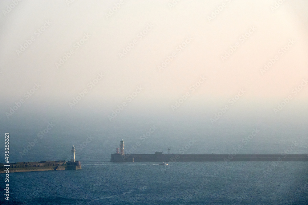 Bay. Lighthouses. Winter haze in the UK 