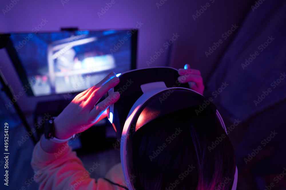 Woman interacts with virtual reality using a vr headset. Woman interacts with virtual reality using a vr headset.