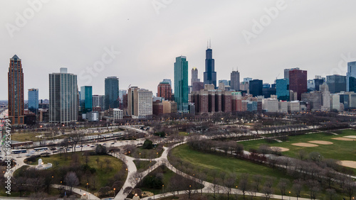 Chicago  IL USA- march 13th 2022  aerial drone shot of downtown Chicago by the river during early spring summer.  the beautiful skyscrapers look futuristic  along the green lake water