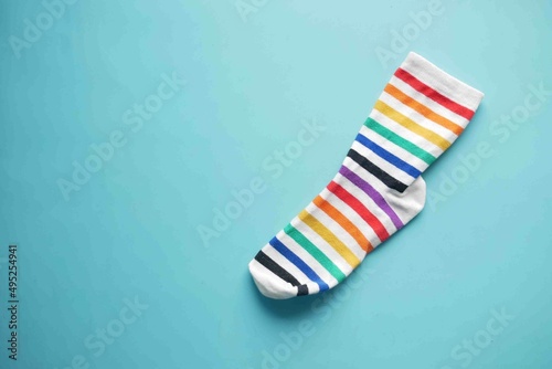 colorful sock on green background with copy space ,