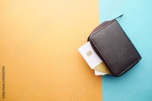 close up of credit cards in a wallet on wooden background 