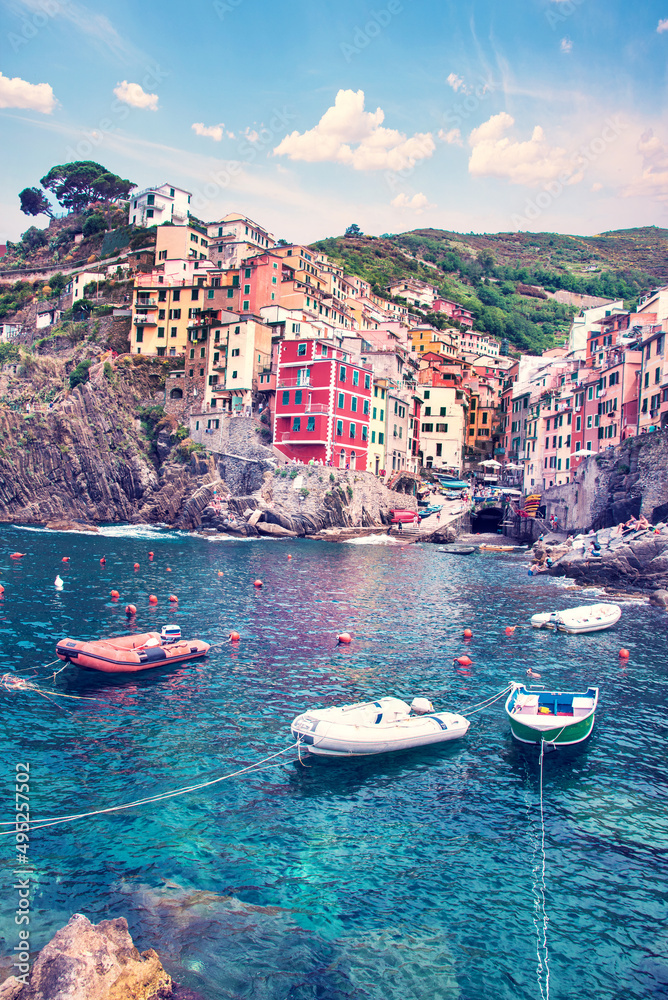 Amazing cityscape with boats and colored houses in Riomaggiore, Cinque Terre, Italy. Amazing places. A popular vacation spot.