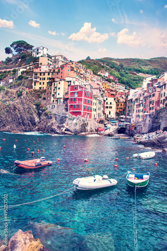 Amazing cityscape with boats and colored houses in Riomaggiore, Cinque Terre, Italy. Amazing places. A popular vacation spot.
