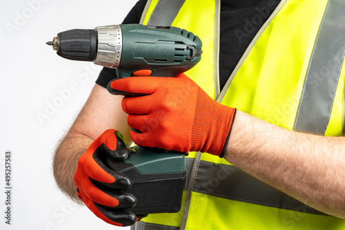 Hands with the drill or scr...